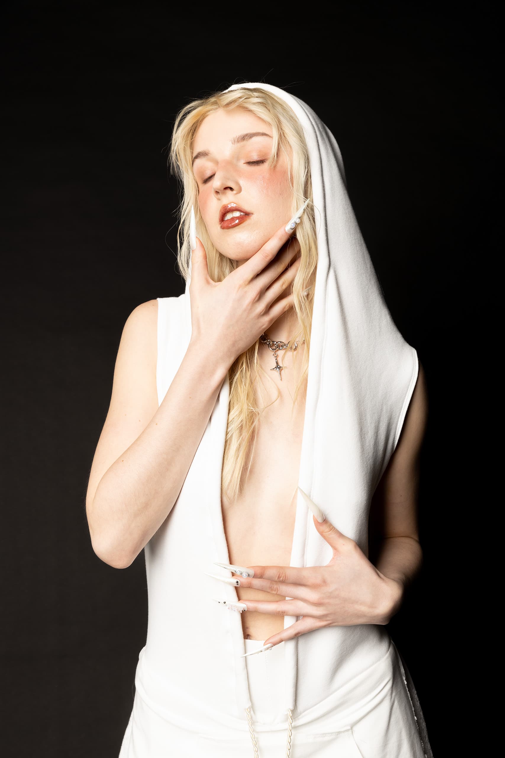 © 2026 Linh Chi Nguyen & Thanh Van Nguyen — The Running Bride: Hooded open-front bridal top detail
